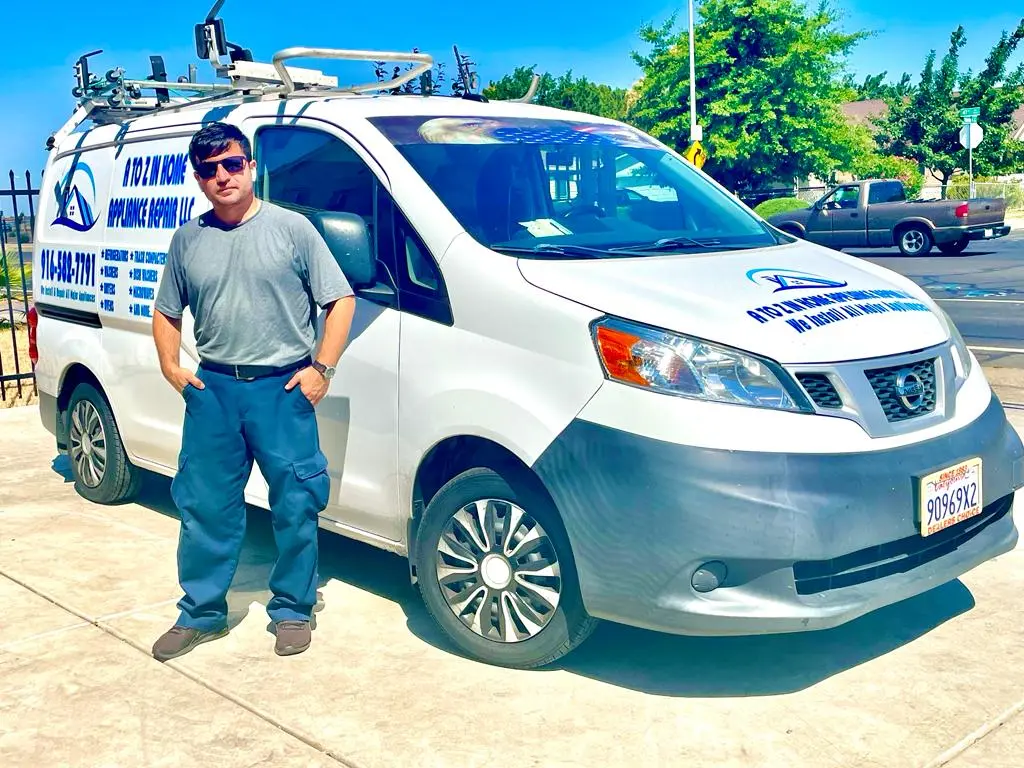 A to Z service van parked at a home with a technician standing beside it