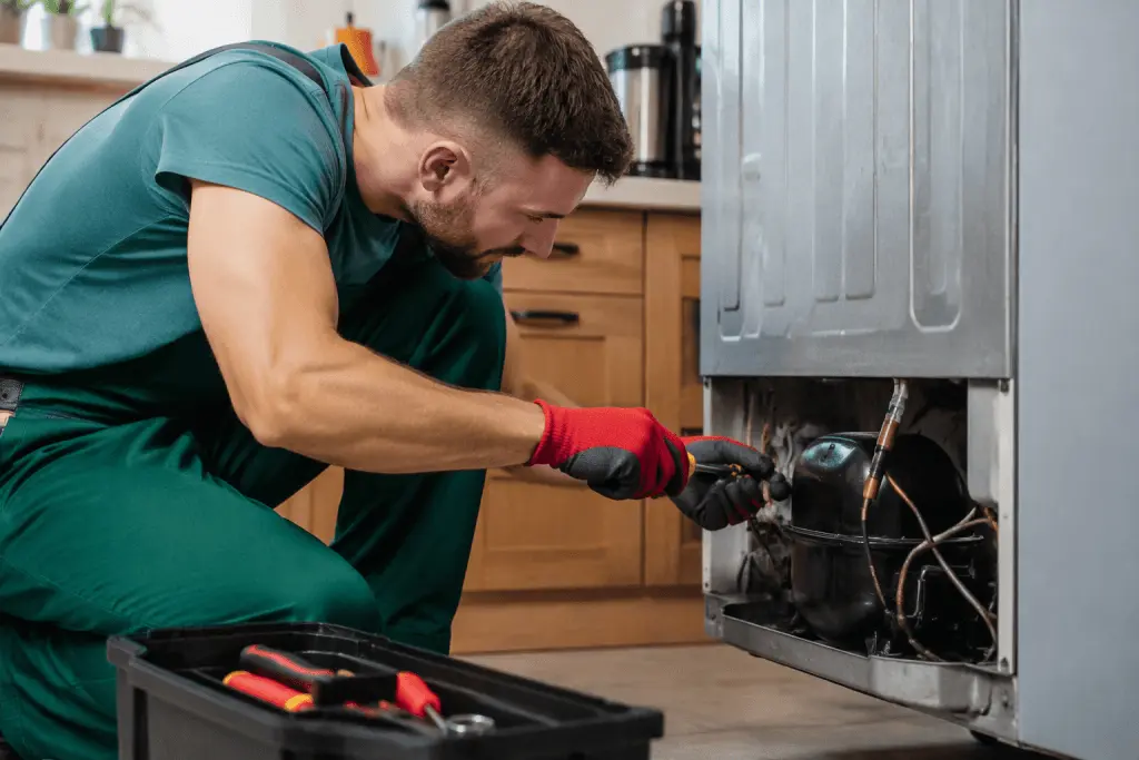 Homeowner listening to strange appliance noises coming from a washing machine