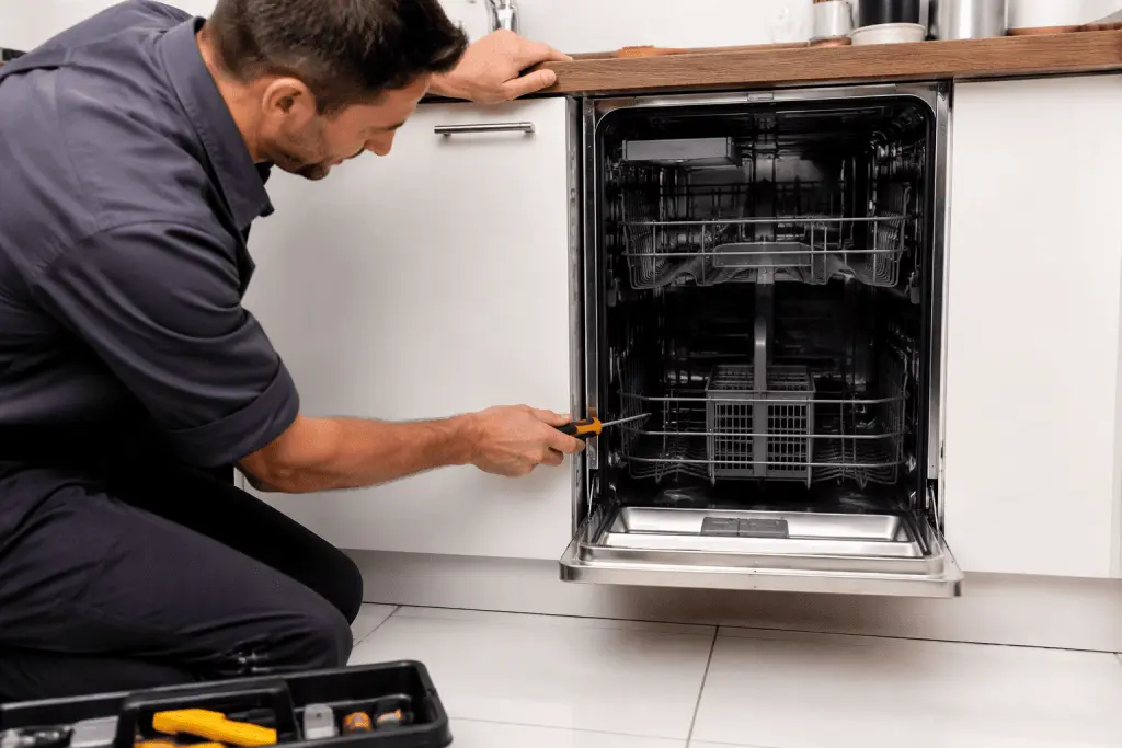 Measuring the cabinet opening before dishwasher installation
